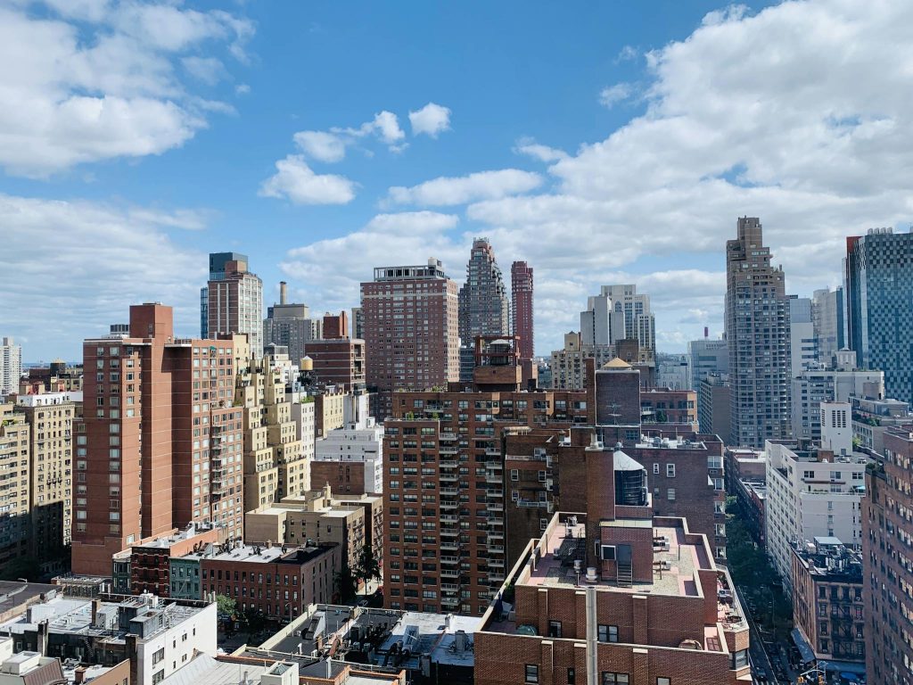 Exterior of modern residential and office towers located in urban big city district on sunny clear day